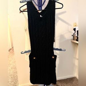 Black, sleeveless sweater dress with pockets